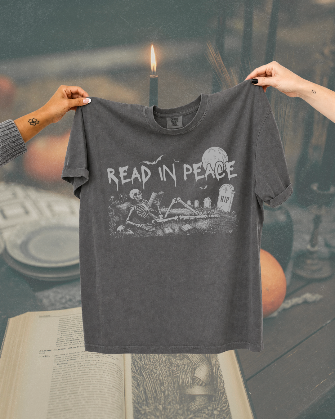 Read in Peace Skeleton Reader Graphic Tee