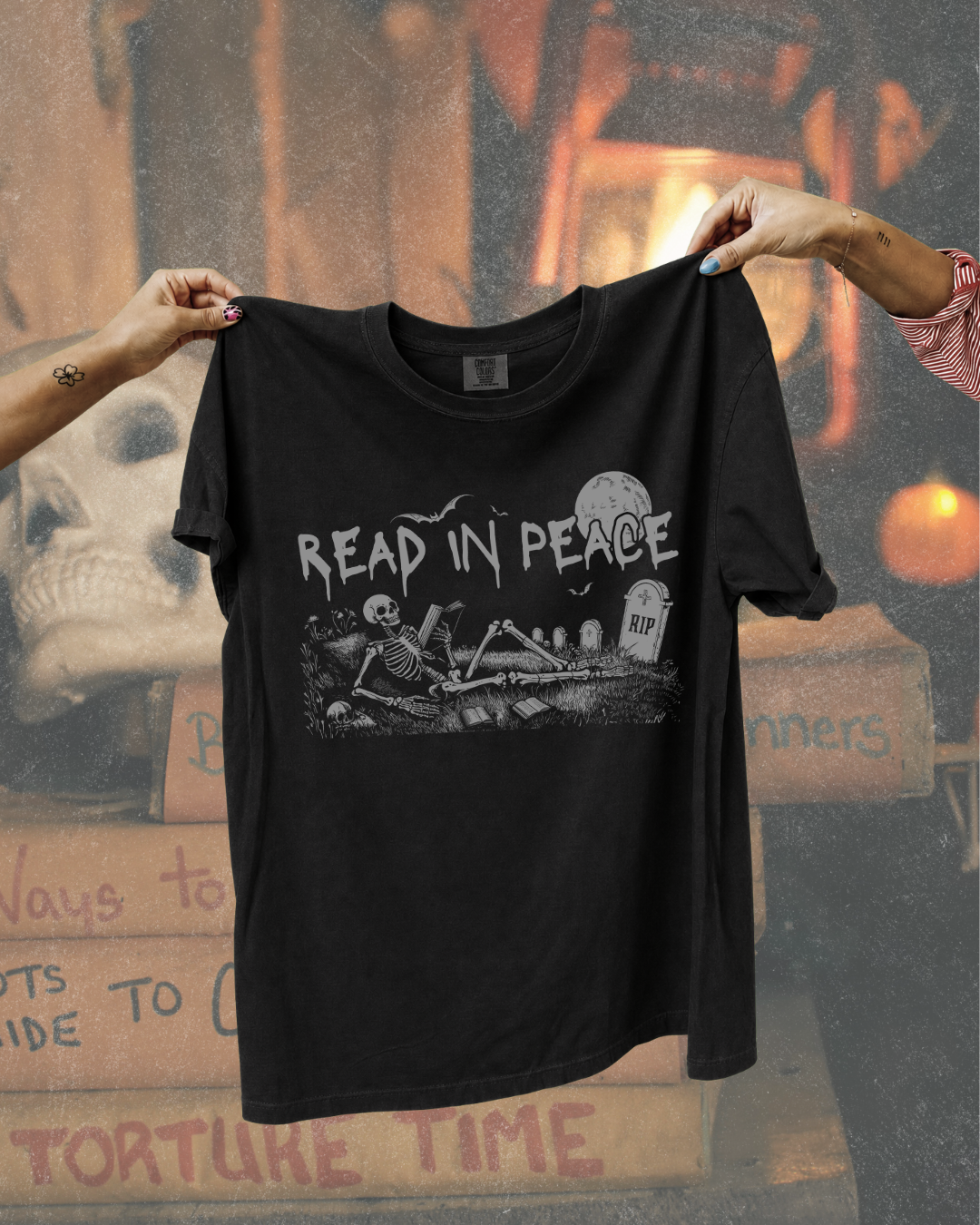 Read in Peace Skeleton Reader Graphic Tee